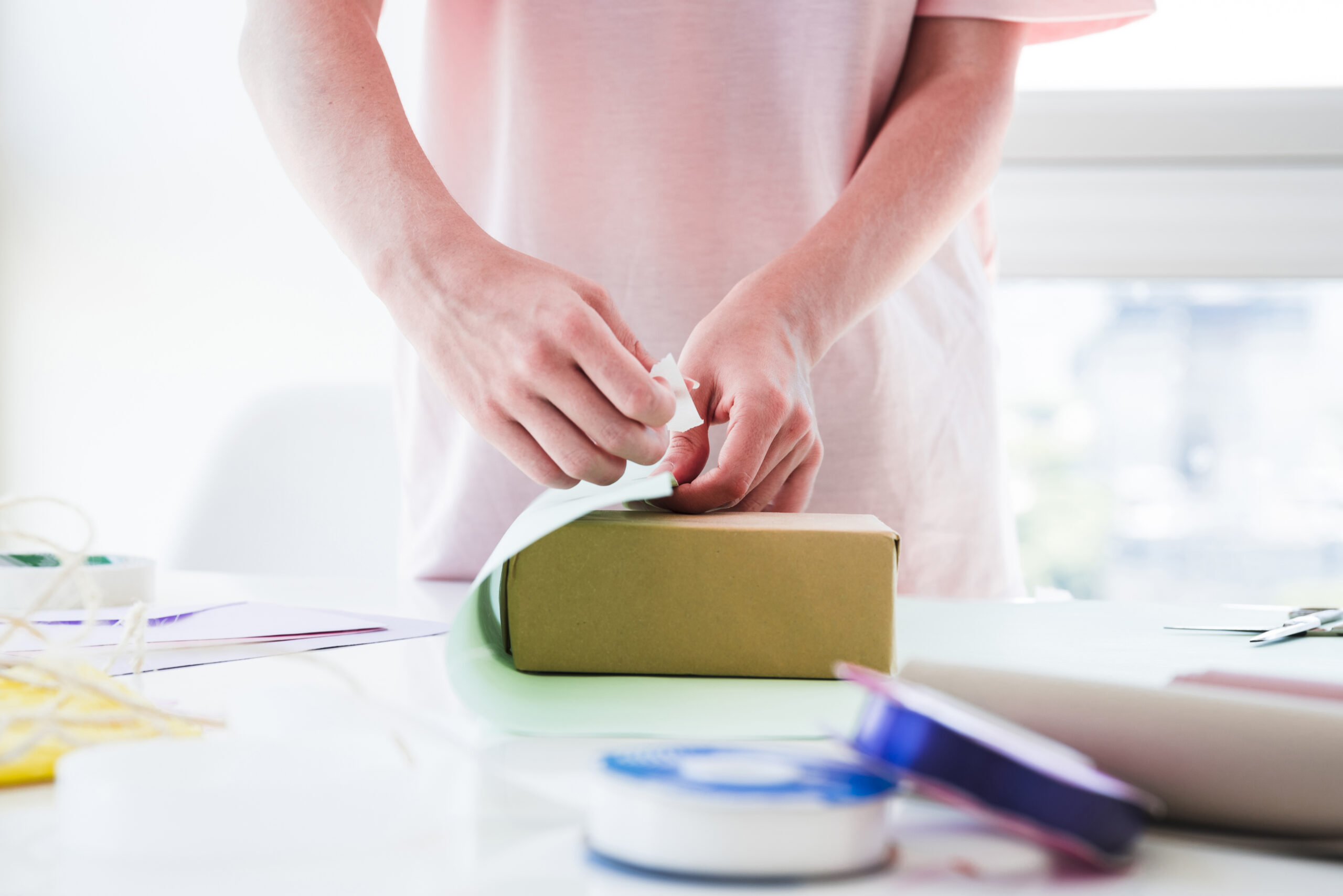 Close-up of putting a label for an FBA shipment.