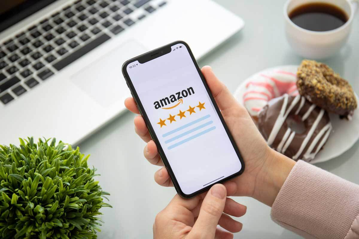 Five-star Amazon product reviews on a mobile screen. Positive reviews improve conversion rate and Amazon ranking.